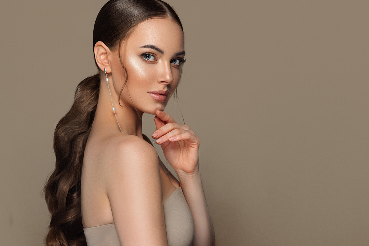 Fashionable and stylish woman in trendy jewelry big earrings rings